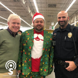 Superintendent with Christmas for Kids volunteers