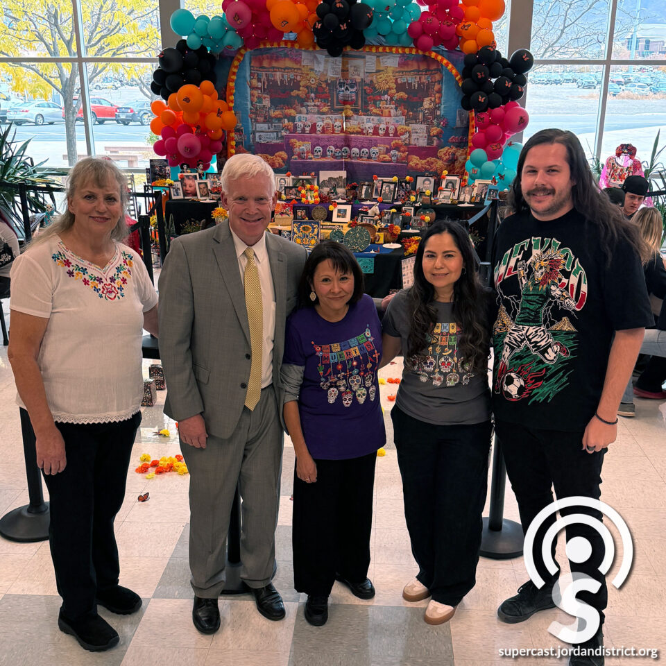 Superintendent with student and staff celebrating the day of the dead