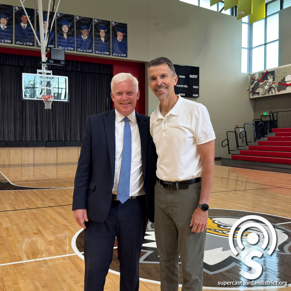 Two superintendents on a basketball court